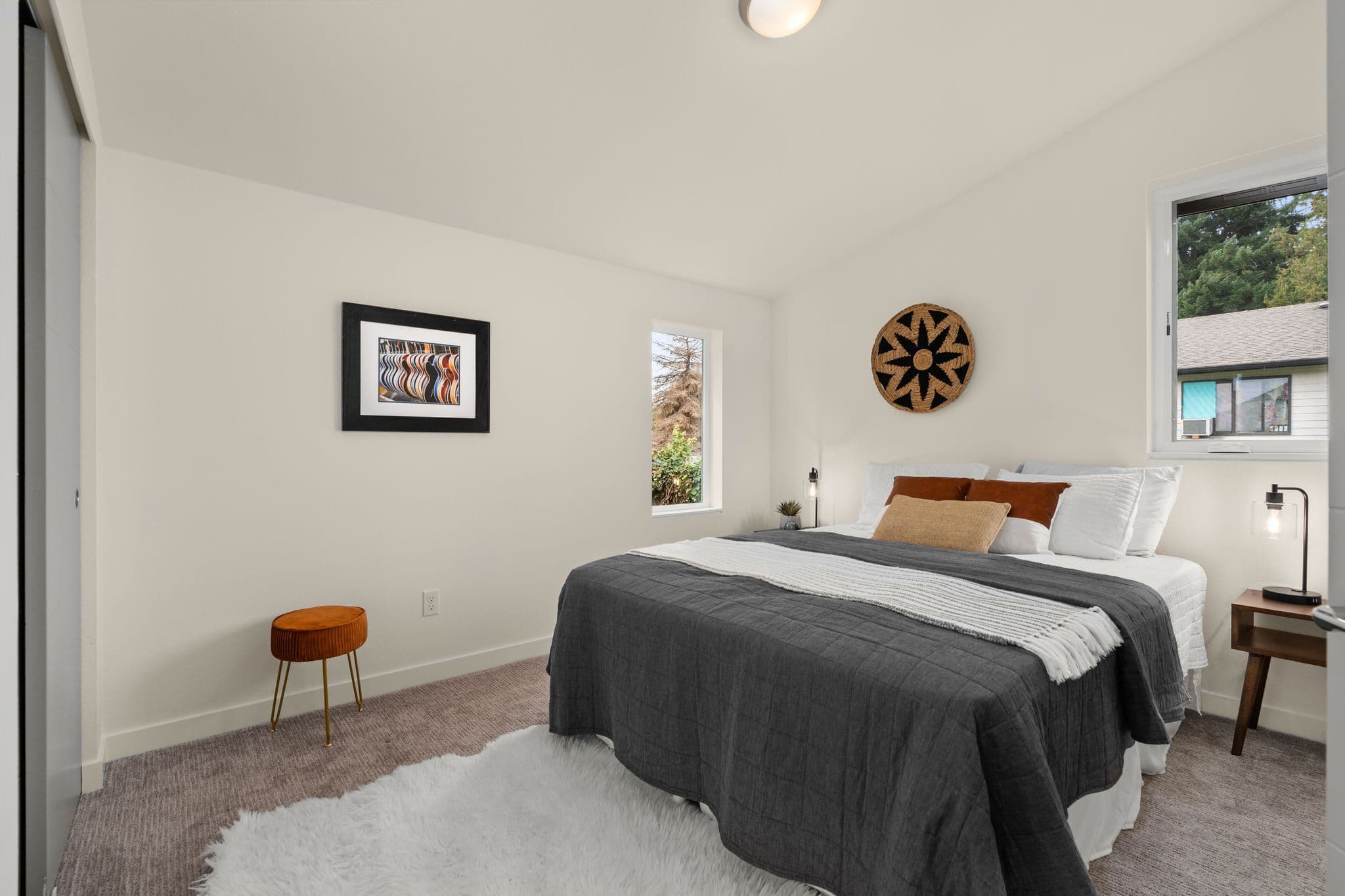 Bedroom with artwork and reading nook