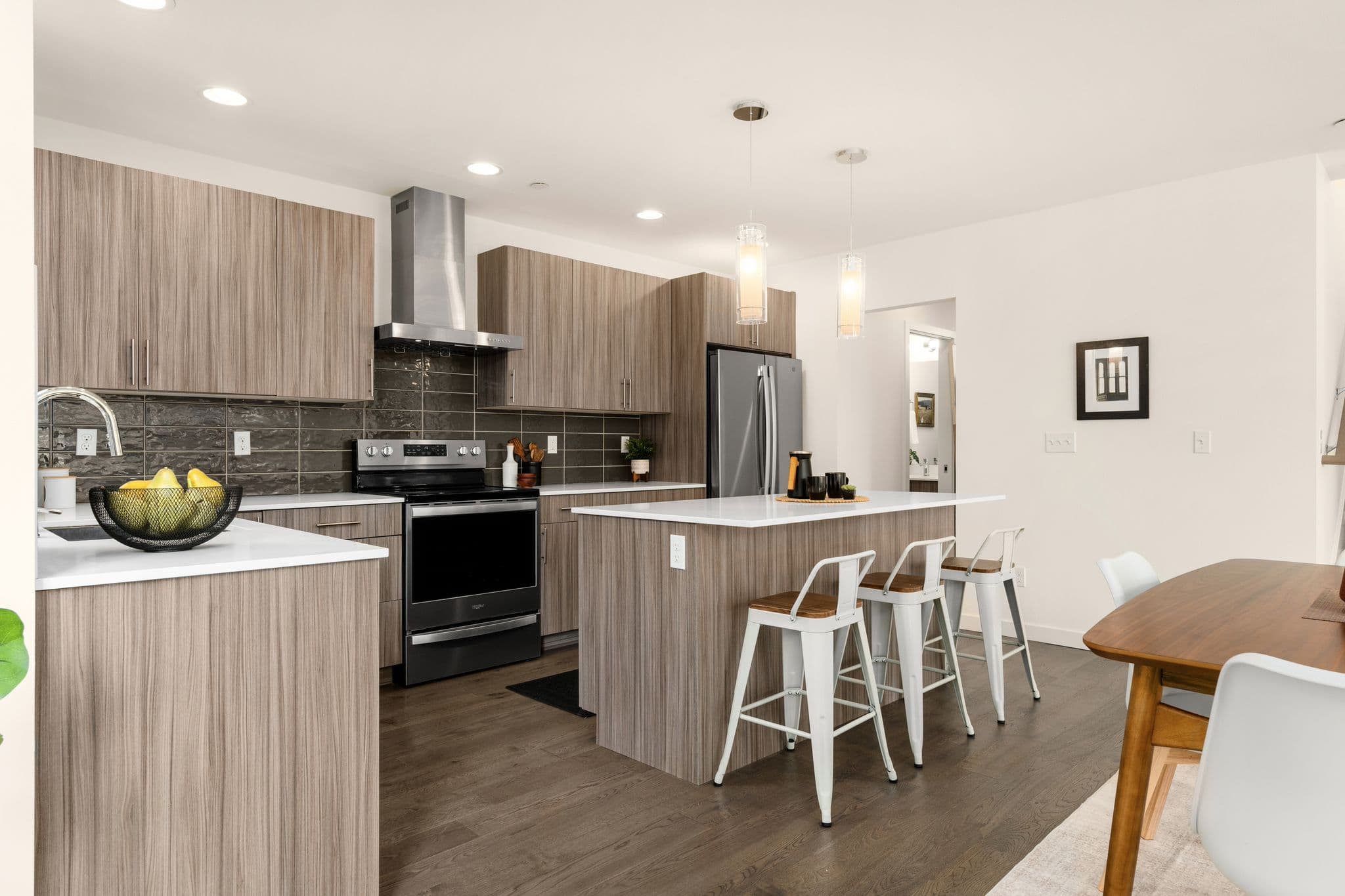 Kitchen with stainless steel appliances and island seating