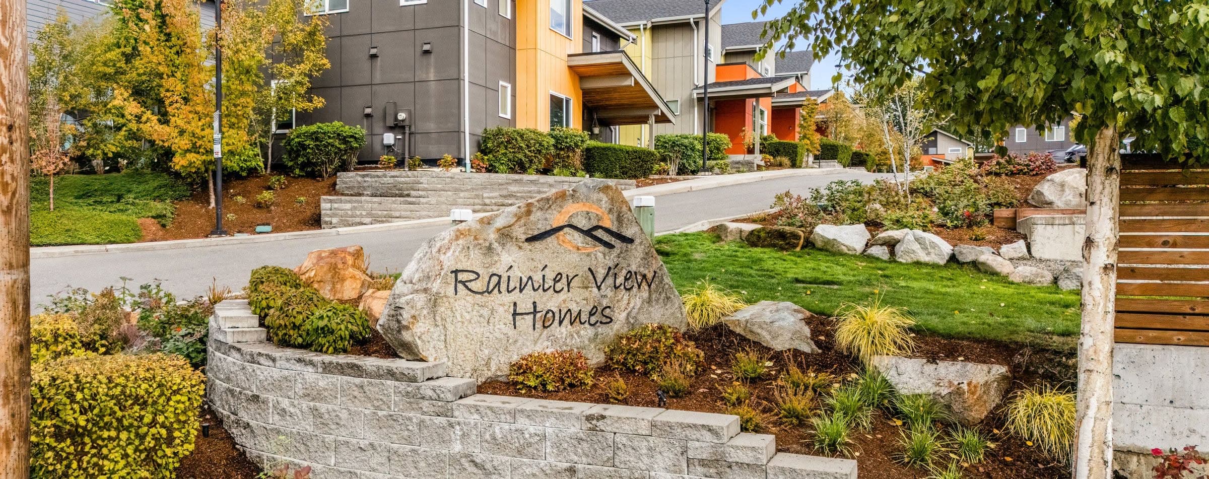 Rainier View Homes community sign with homes in the background